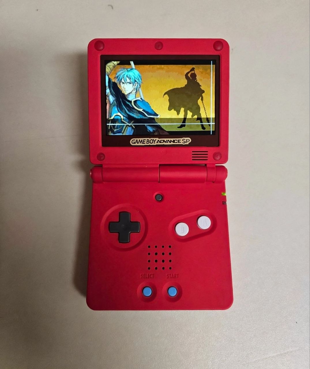 Custom Pokedex-themed Game Boy Advance SP powered on, showing Fire Emblem on the IPS screen