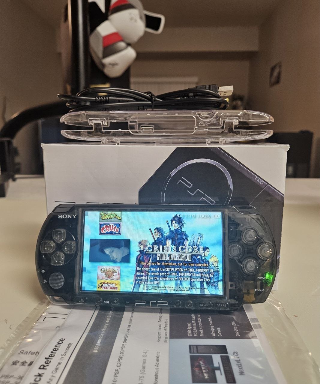 Smoke Phantom PSP-3000 powered on, smoked translucent shell, with box and clear protective case